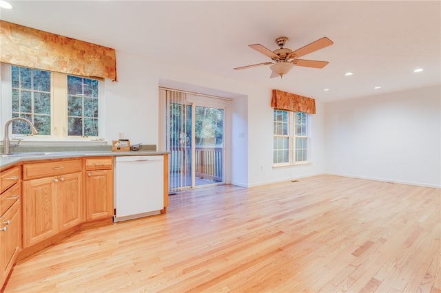 kitchen with ceiling fan, white dishwasher, sink, and light hardwood / wood-style floors