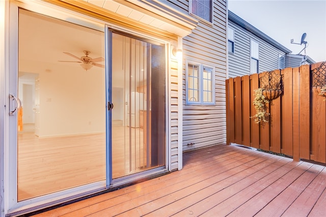 wooden terrace featuring ceiling fan