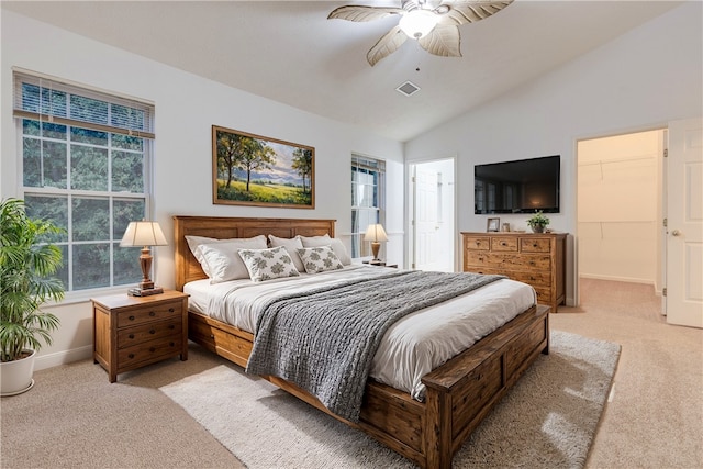 carpeted bedroom featuring ceiling fan and vaulted ceiling