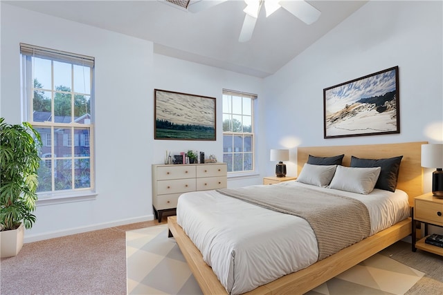 carpeted bedroom featuring ceiling fan and vaulted ceiling