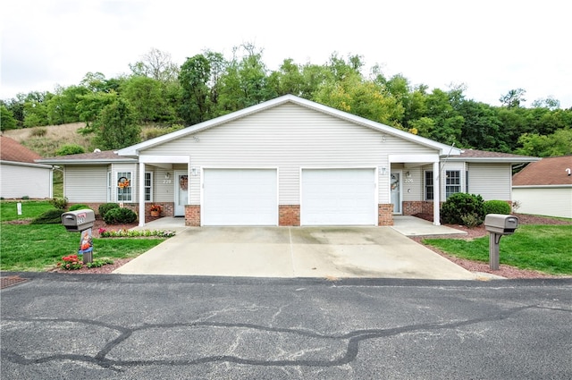 single story home with a garage