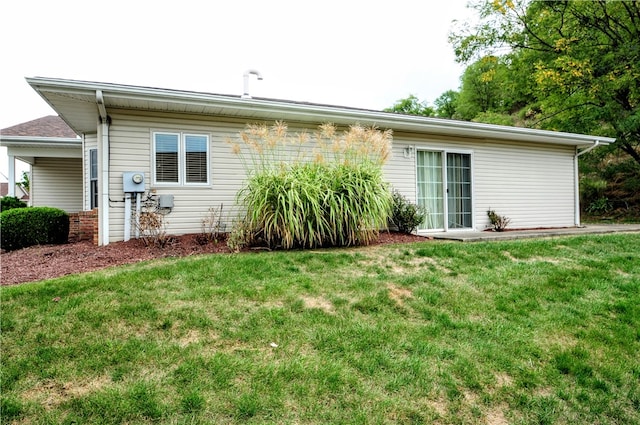 rear view of house with a yard