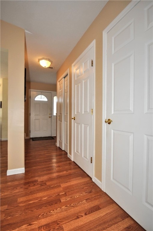 corridor featuring wood-type flooring