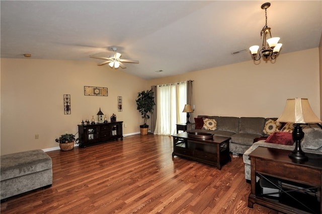 living room featuring ceiling fan with notable chandelier, vaulted ceiling, and dark hardwood / wood-style floors