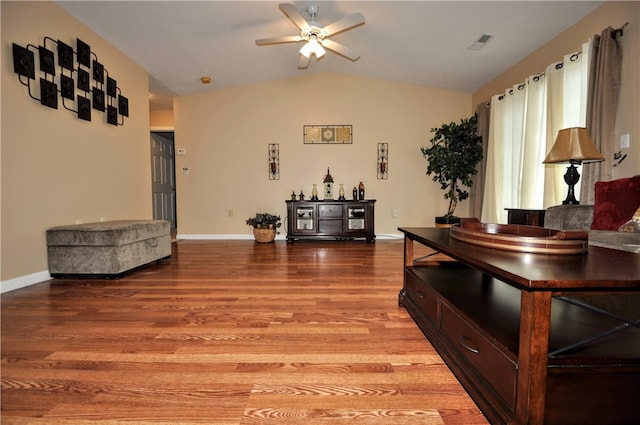 interior space featuring ceiling fan, vaulted ceiling, and light hardwood / wood-style floors