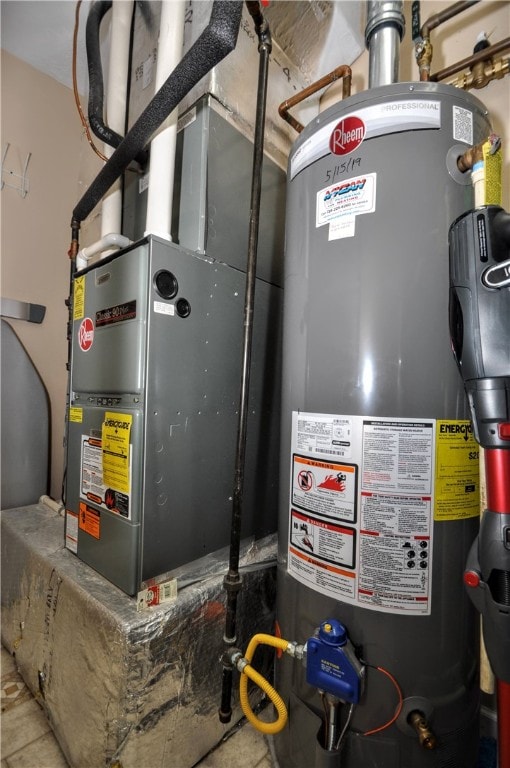 utility room with water heater