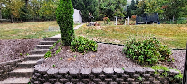 view of yard with a trampoline