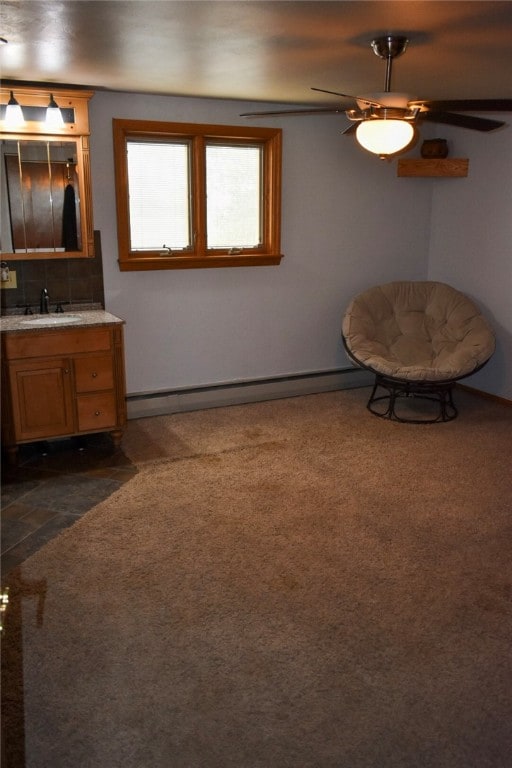 bathroom with vanity, ceiling fan, and a baseboard radiator