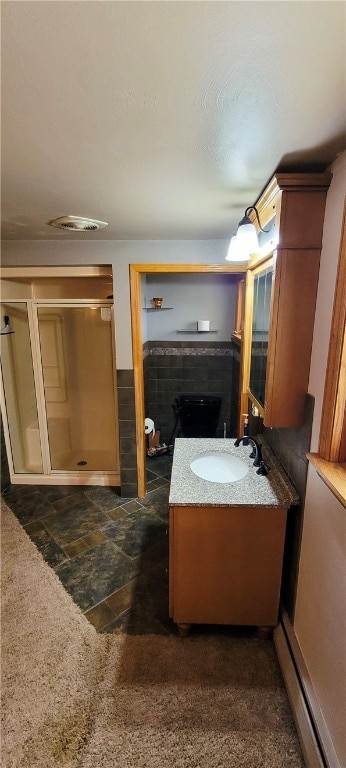 bathroom featuring vanity and a fireplace