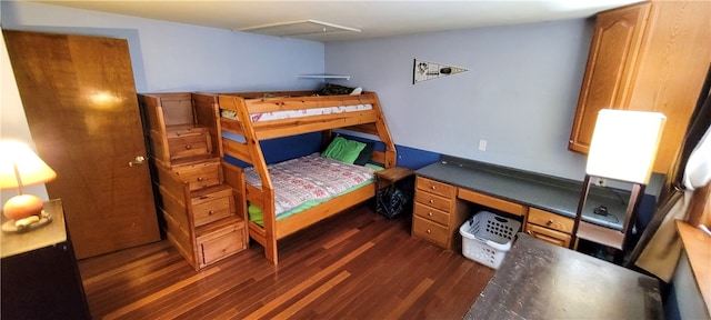 bedroom with dark hardwood / wood-style floors