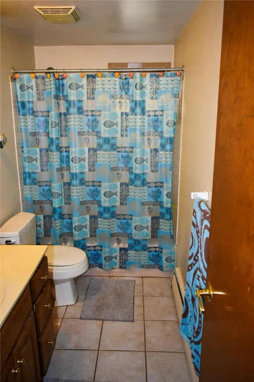 bathroom featuring walk in shower, vanity, toilet, and tile patterned floors