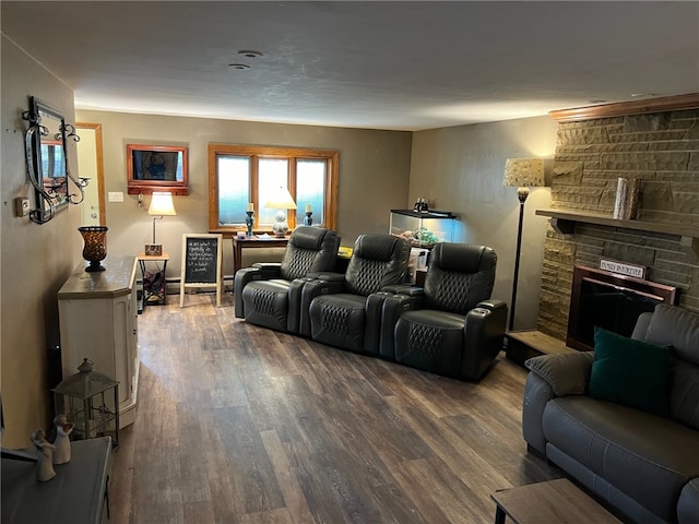 living room featuring wood-type flooring and a fireplace