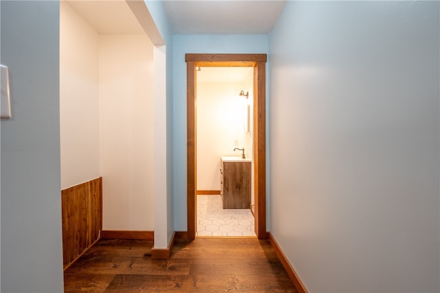 hall with sink and dark hardwood / wood-style flooring