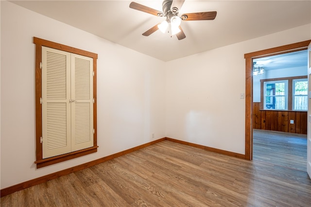 unfurnished room with ceiling fan and hardwood / wood-style flooring