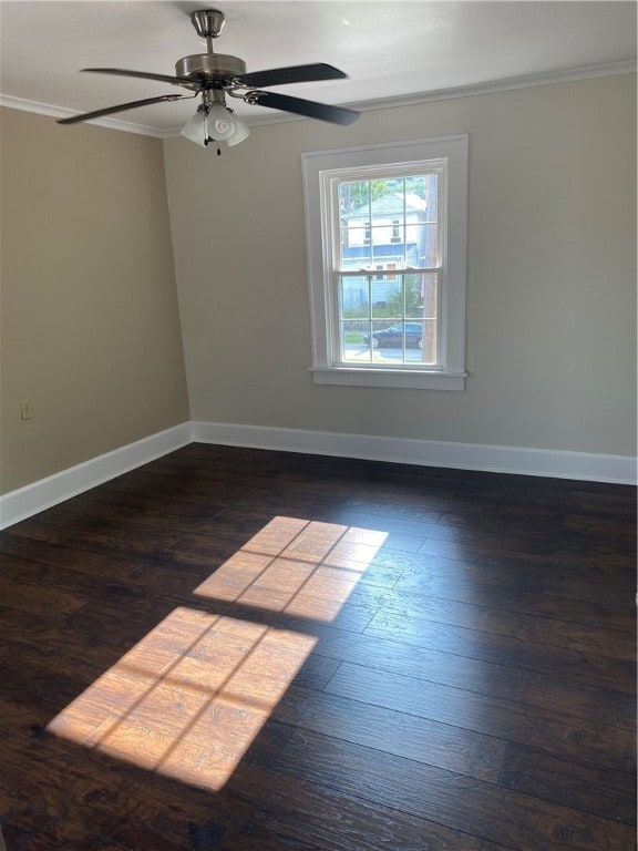 spare room with ceiling fan, dark hardwood / wood-style floors, and ornamental molding