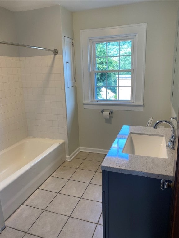 bathroom featuring vanity, bathing tub / shower combination, and tile patterned flooring