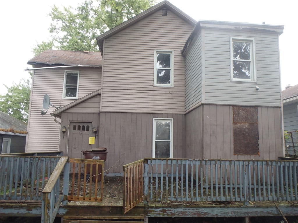 back of house featuring a deck