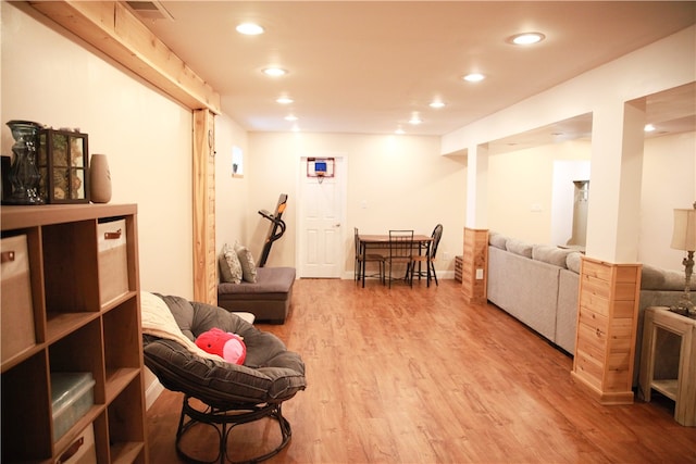 sitting room with wood-type flooring