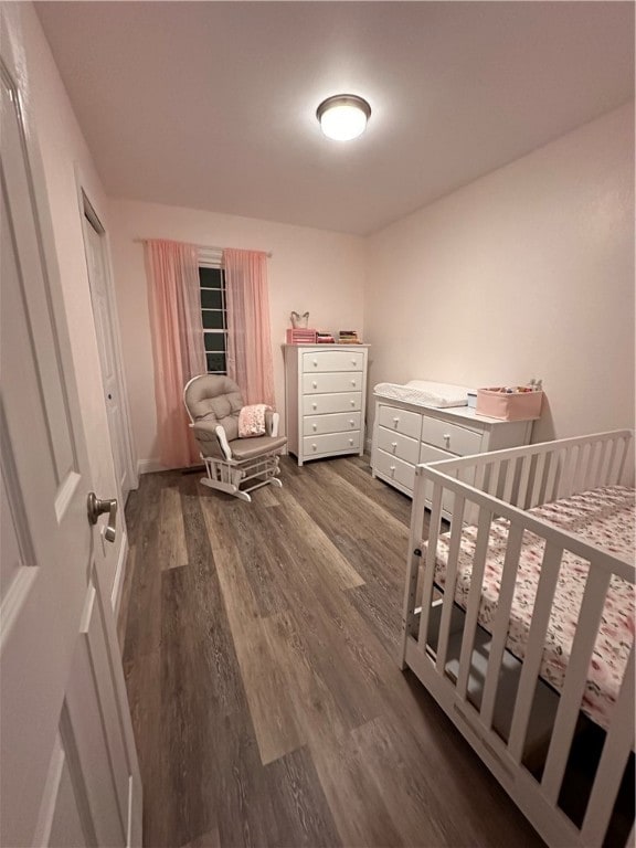 bedroom featuring dark hardwood / wood-style flooring