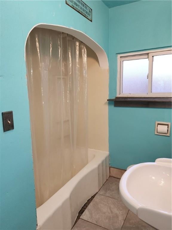 bathroom with shower / tub combo and tile patterned floors