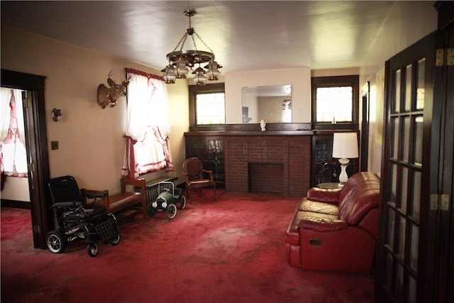 sitting room with a fireplace, carpet flooring, and a wealth of natural light