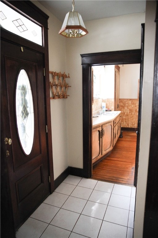 foyer featuring light tile patterned floors