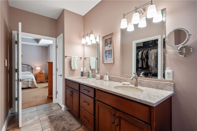 bathroom with tile patterned flooring and vanity