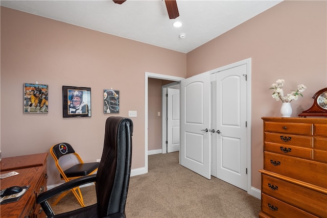 home office with light colored carpet and ceiling fan