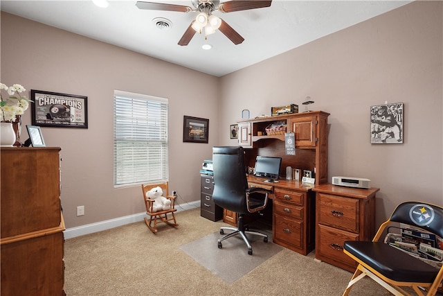 office with light carpet and ceiling fan