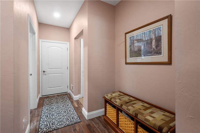 hallway with dark wood-type flooring