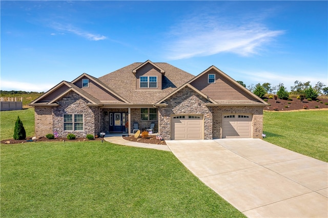 craftsman house with a garage and a front lawn