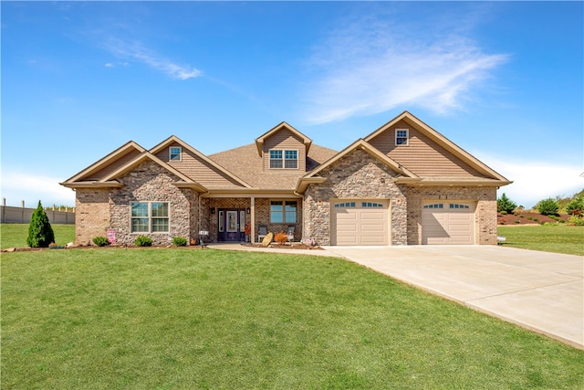 craftsman inspired home with a garage and a front yard