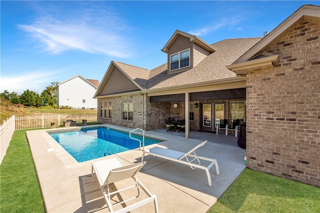 view of swimming pool with a patio area