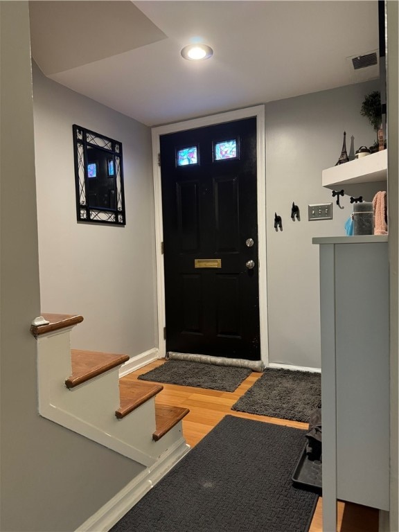 foyer entrance featuring hardwood / wood-style floors