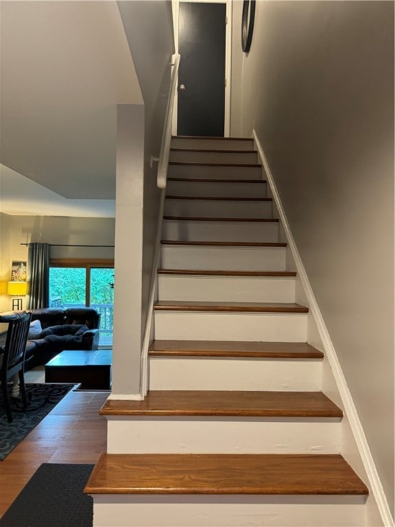 stairway featuring hardwood / wood-style flooring