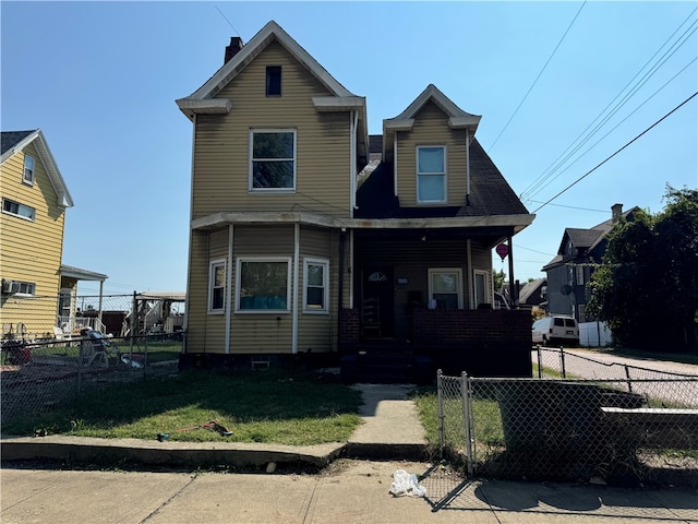 view of front facade with a front yard and cooling unit