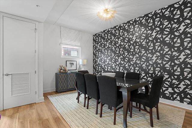 dining room featuring an inviting chandelier and hardwood / wood-style floors