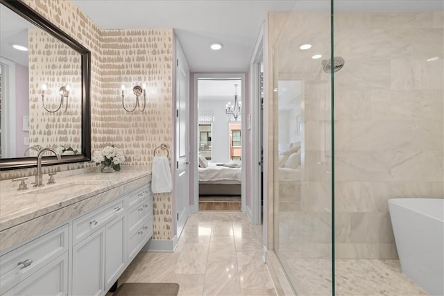 bathroom featuring tile walls, vanity, and separate shower and tub