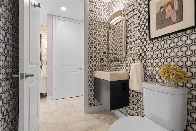 bathroom with vanity and toilet