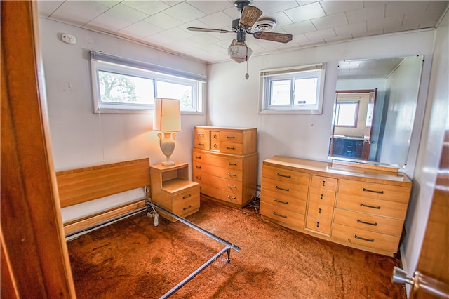 bedroom with dark carpet and ceiling fan