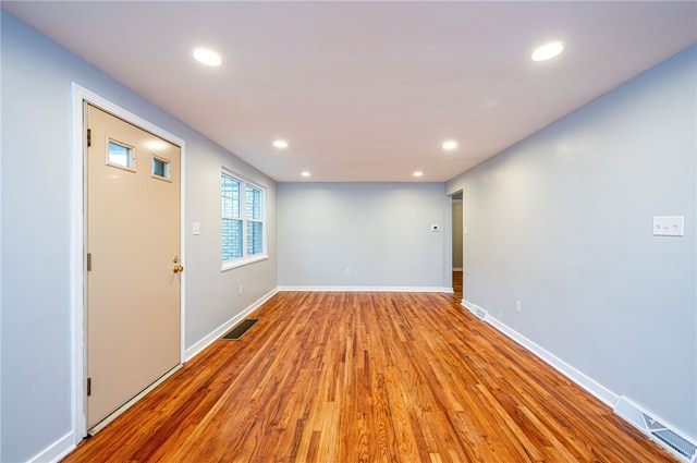 spare room featuring light wood-type flooring