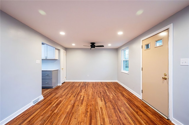 unfurnished room featuring ceiling fan and wood-type flooring