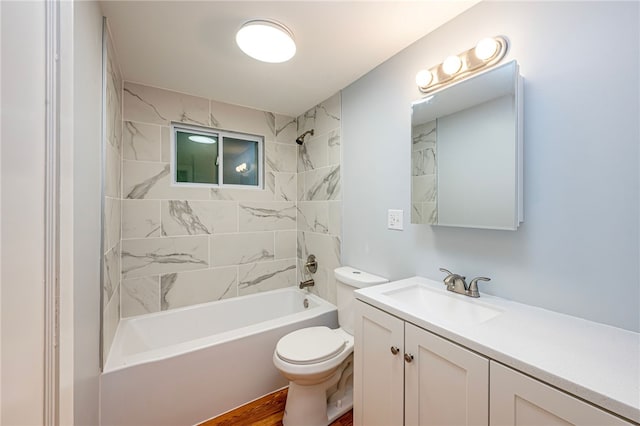 full bathroom featuring wood-type flooring, vanity, toilet, and tiled shower / bath