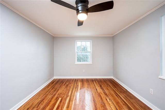 empty room with crown molding, ceiling fan, and light hardwood / wood-style flooring