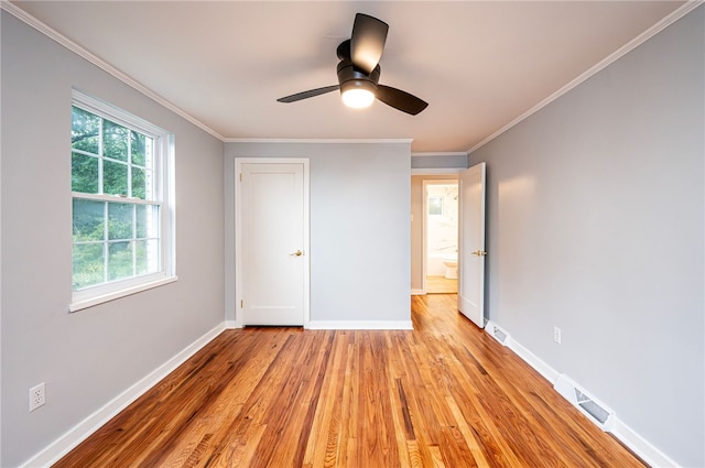 unfurnished bedroom with ceiling fan, crown molding, and light hardwood / wood-style floors