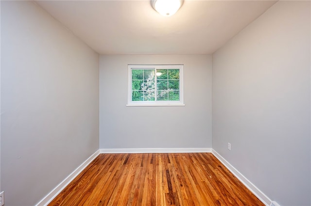 unfurnished room featuring hardwood / wood-style floors