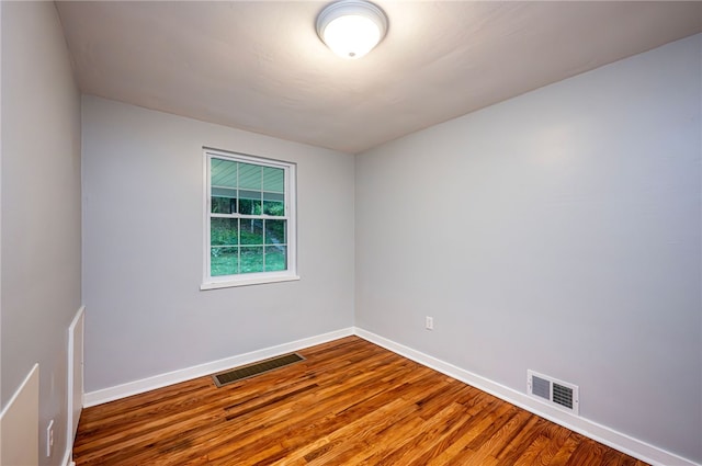 empty room featuring hardwood / wood-style flooring