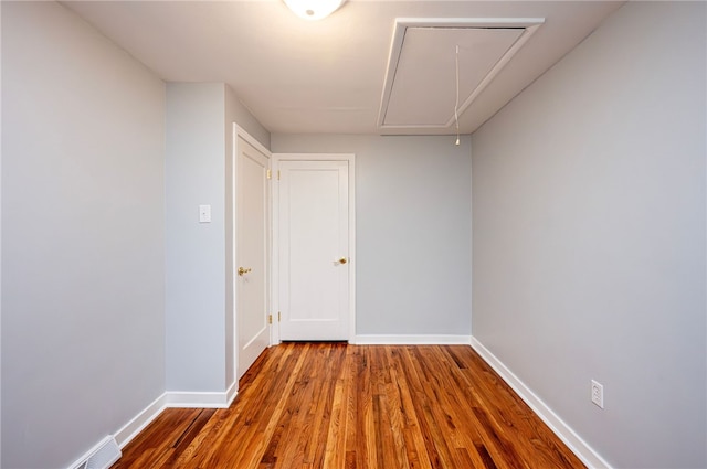 empty room featuring hardwood / wood-style flooring