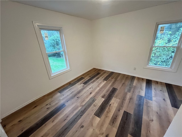 spare room featuring hardwood / wood-style flooring