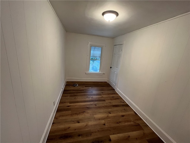 doorway to outside with wood walls and dark hardwood / wood-style flooring